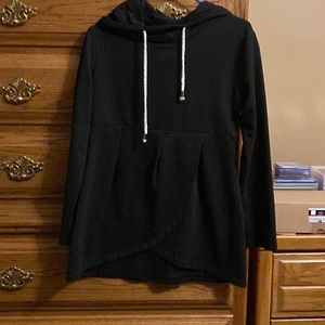 Woman’s black ruffled bottom sweatshirt.